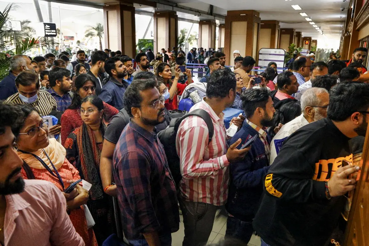 Stranded passengers wait in queues to enquire about flight status at Sardar Vallabhbhai Patel International Airport amid IndiGo flight disruptions, in Ahmedabad | Photo: PTI