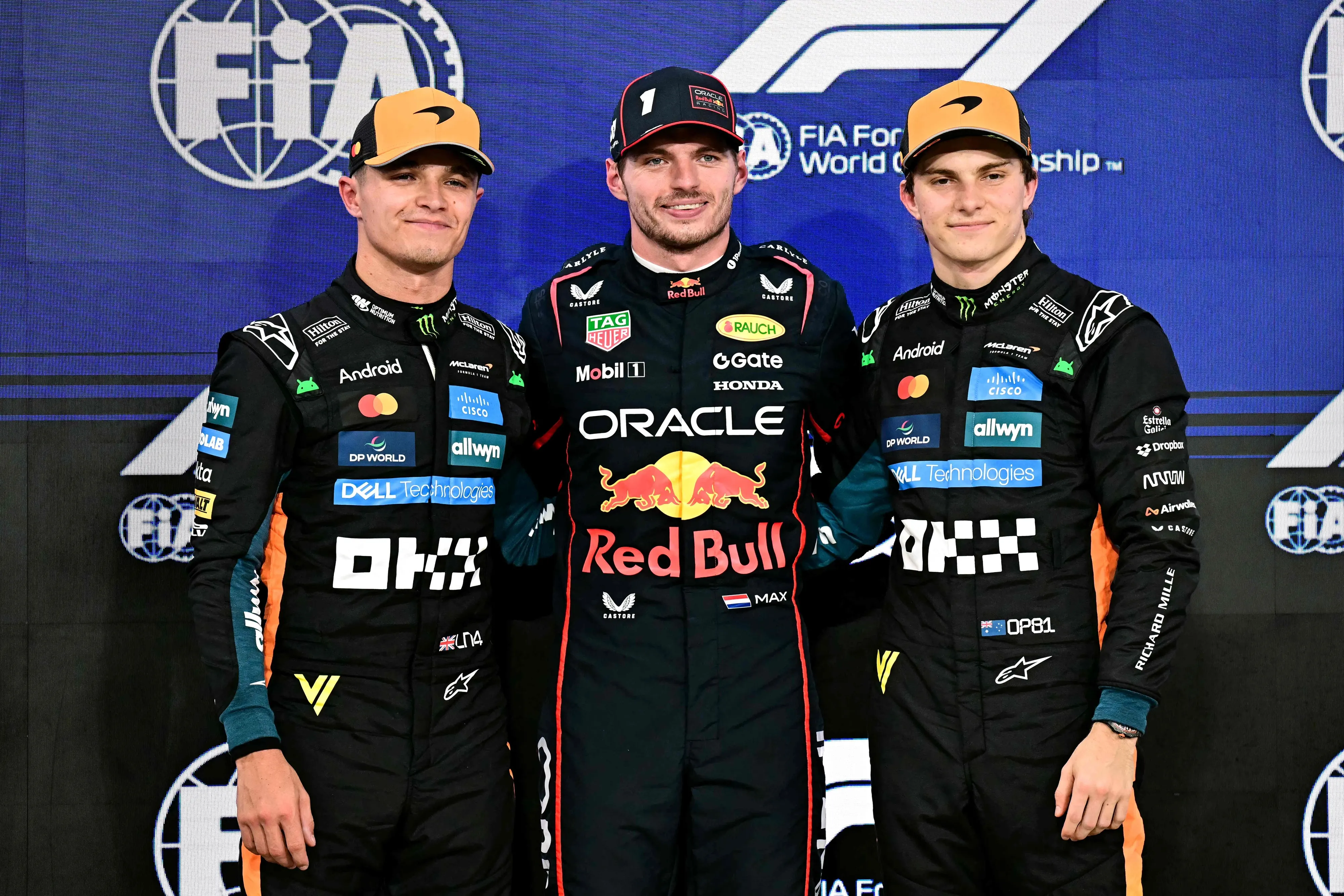 McLaren's British driver Lando Norris. Red Bull Racing's Dutch driver Max Verstappen, and McLaren's Australian driver Oscar Piastri pose for a picture after the qualifying session ahead of the Abu Dhabi Formula One Grand Prix at the Yas Marina Circuit in Abu Dhabi on December 6, 2025. | Photo: AFP
