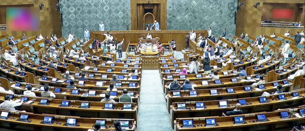 Opposition MPs create a ruckus in Lok Sabha during the winter session of Parliament.in New Delhi | ANI