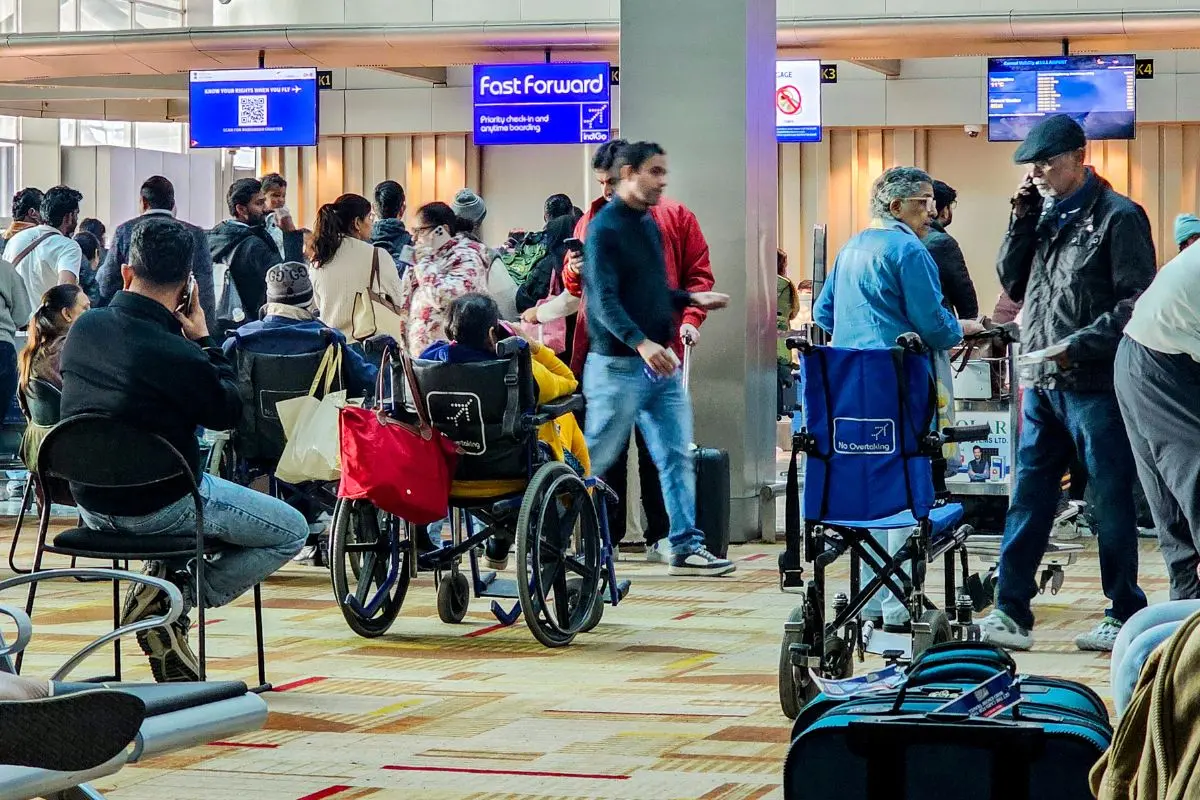 Passengers wait at counters of the IndiGo airline in the Indira Gandhi International Airport, in New Delhi | Photo: PTI