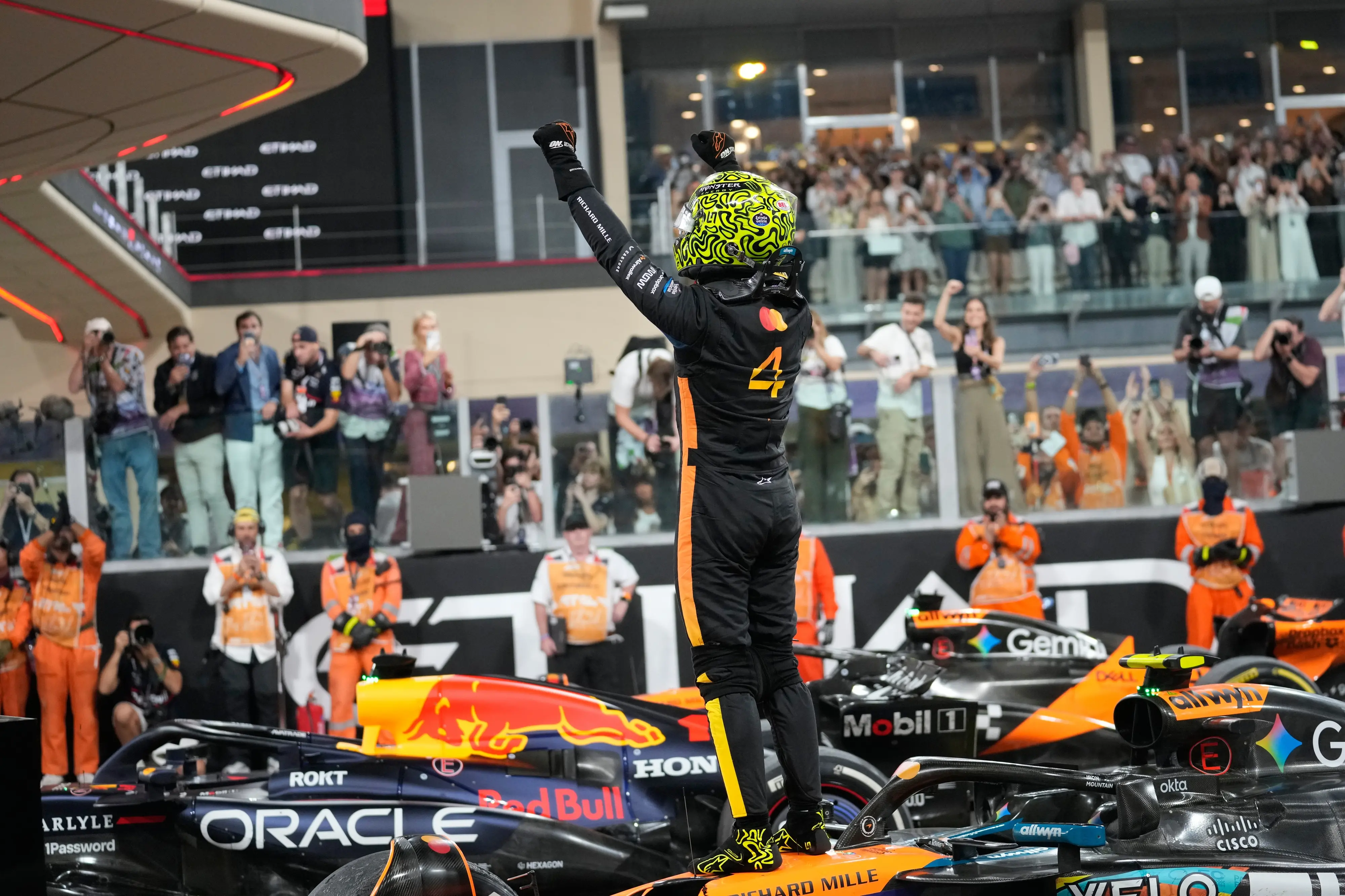McLaren driver Lando Norris of Britain celebrates after becomin a world champion after the Abu Dhabi Formula One Grand Prix in Abu Dhabi | Photo: AP