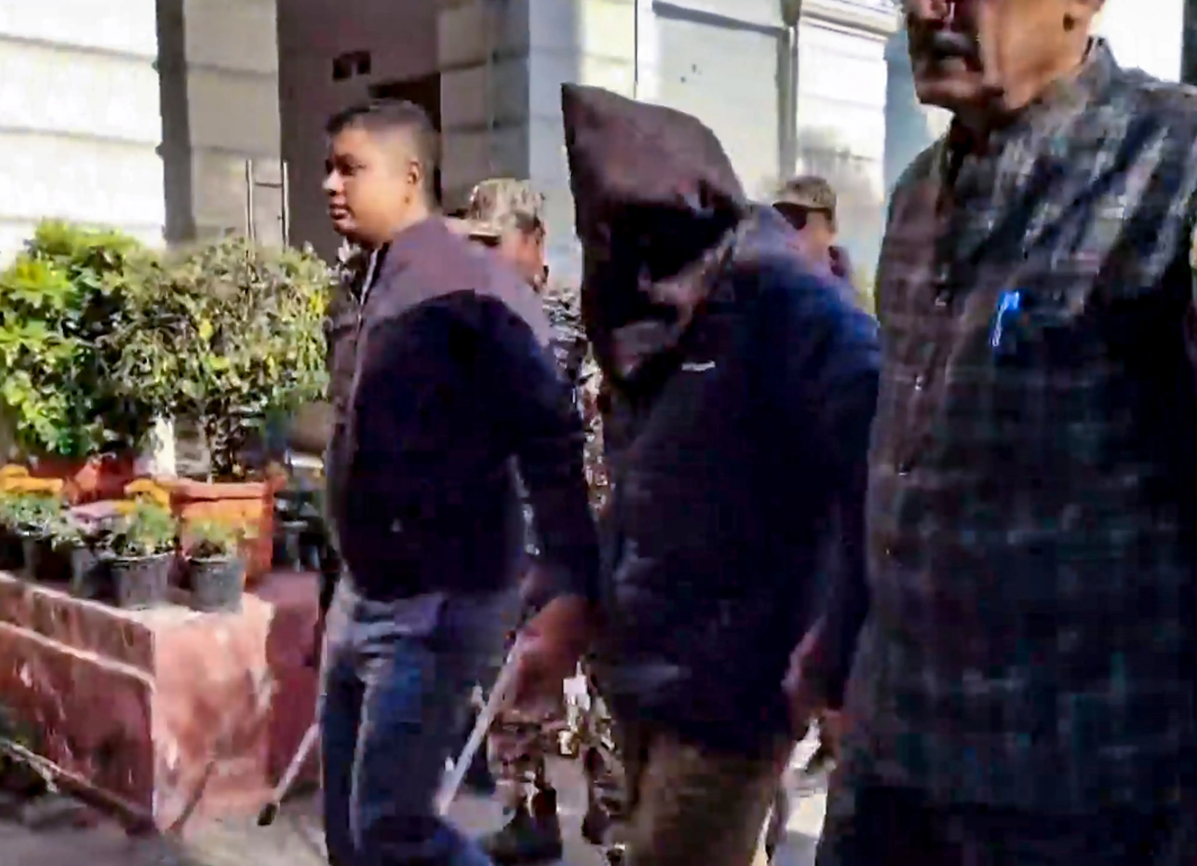 Amir Rashid Ali, an accused in the Red Fort blast case, face covered, while being produced at the Patiala House Court, in New Delhi | Photo: PTI