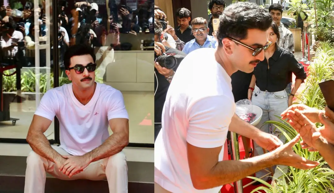 Bollywood actor Ranbir Kapoor greets people during the launch of his lifestyle store (Photo: PTI)