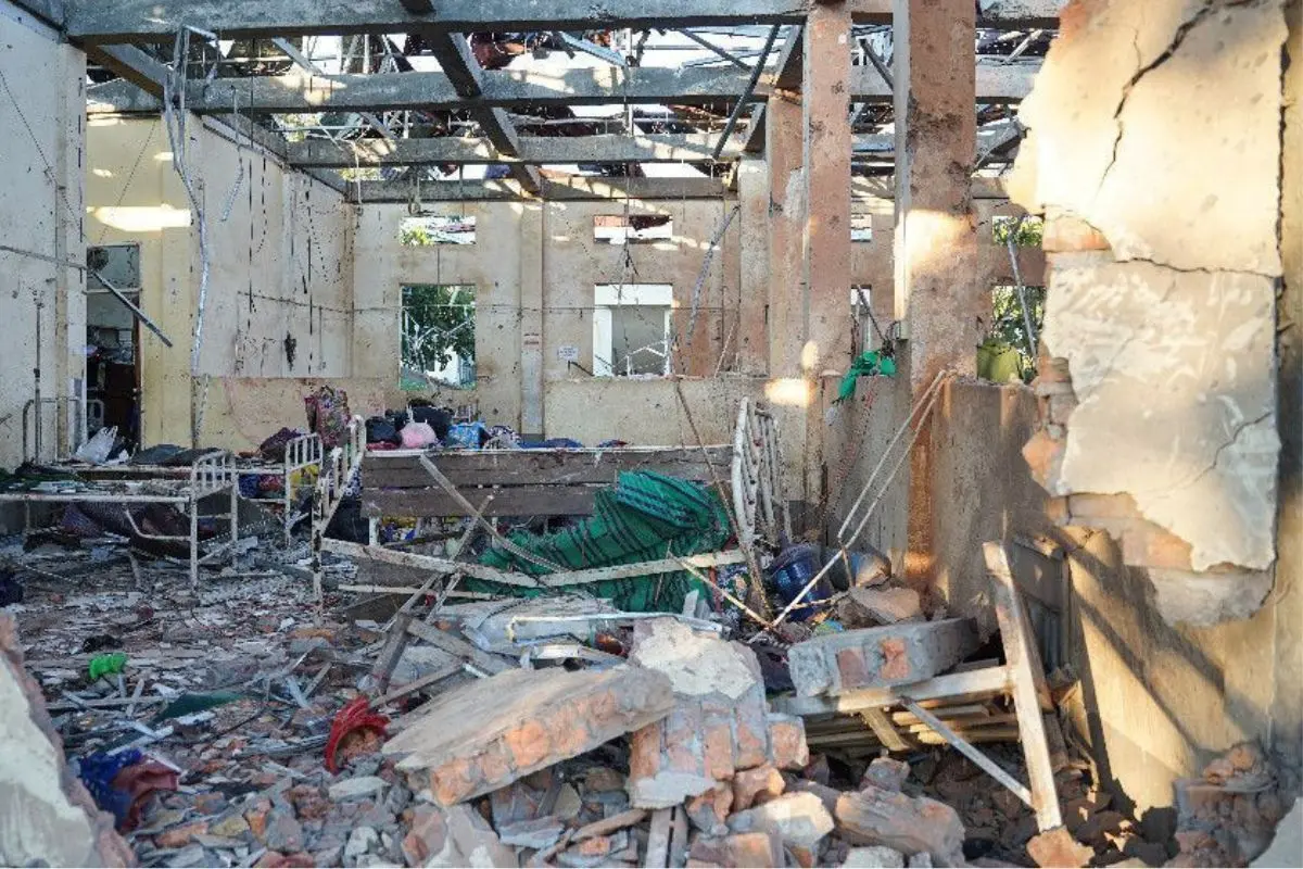 Debris and twisted metal surround the blasted wing of Mrauk-U General Hospital after a Myanmar junta air strike left the facility in ruins. Photo: AFP
