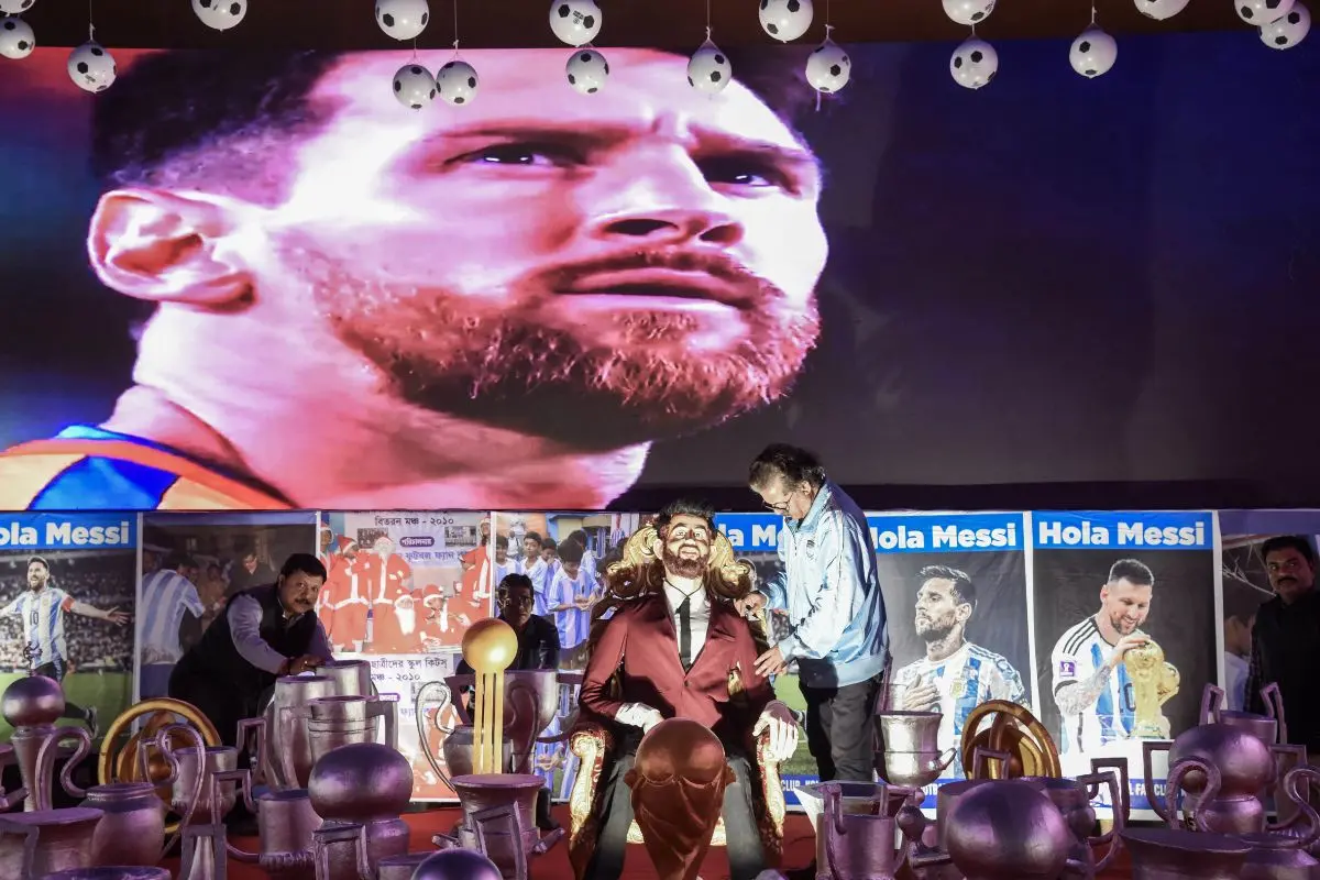 A replica of Lionel Messi, seated on a throne beneath 896 footballs and trophies, was unveiled at the 'Hola Messi' fan zone ahead of his planned visit, in Kolkata on Thursday | Photo: ANI