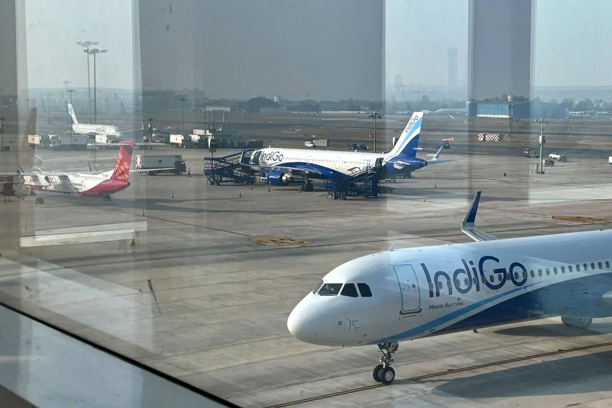 File Photo: Two Indigo Airlines planes are seen through a glass window at the Indira Gandhi International Airport in New Delhi | AP