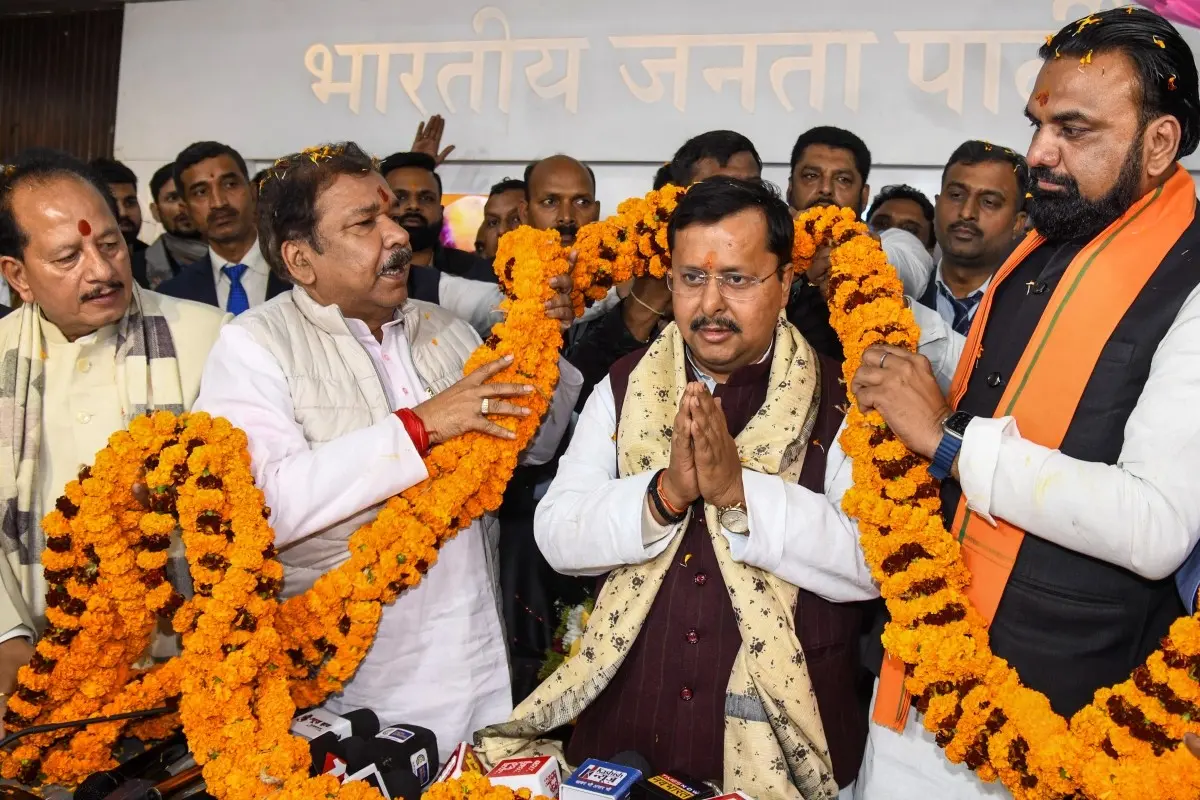 Bihar Deputy Chief Ministers Vijay Kumar Sinha, left, and Samrat Choudhary, right, and state BJP President Dilip Jaiswal, second left, felicitate state Minister Nitin Nabin after the latter was appointed BJP's working national president, in Patna.