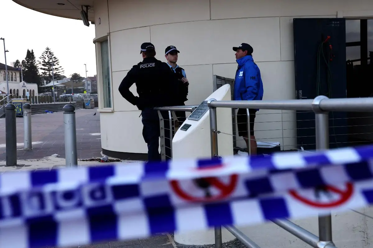 Police and forensic experts inspect at the scene of a shooting at Bondi Beach in Sydney on December 15, 2025. AFP