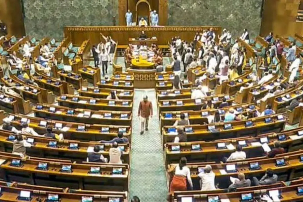 Opposition MPs raise slogans and rush the Well of the Lok Sabha as proceedings are disrupted during Zero Hour, forcing the House to be adjourned till 2 pm amid demands for an apology from Union Home Minister Amit Shah. Screengrab: PTI video