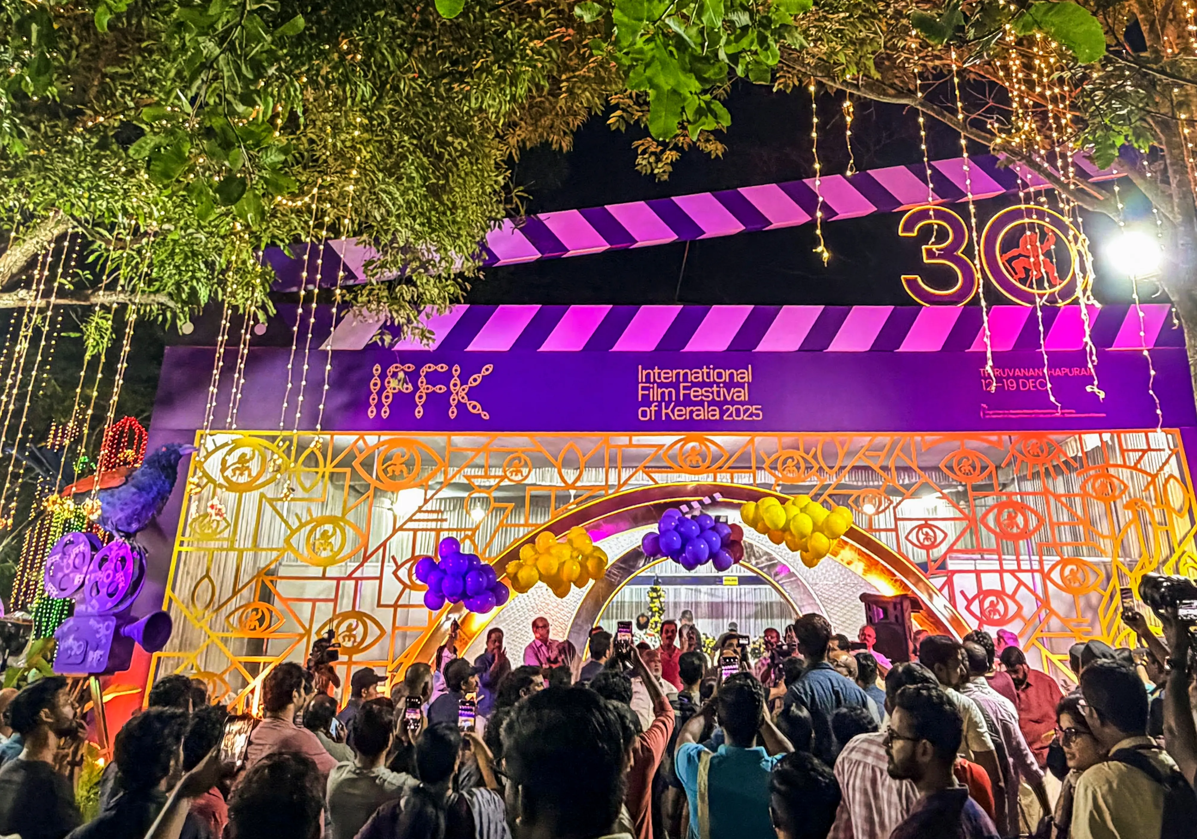 People gather at the office of the 30th International Film Festival of Kerala (IFFK) at Tagore Theatre, in Thiruvananthapuram | PTI