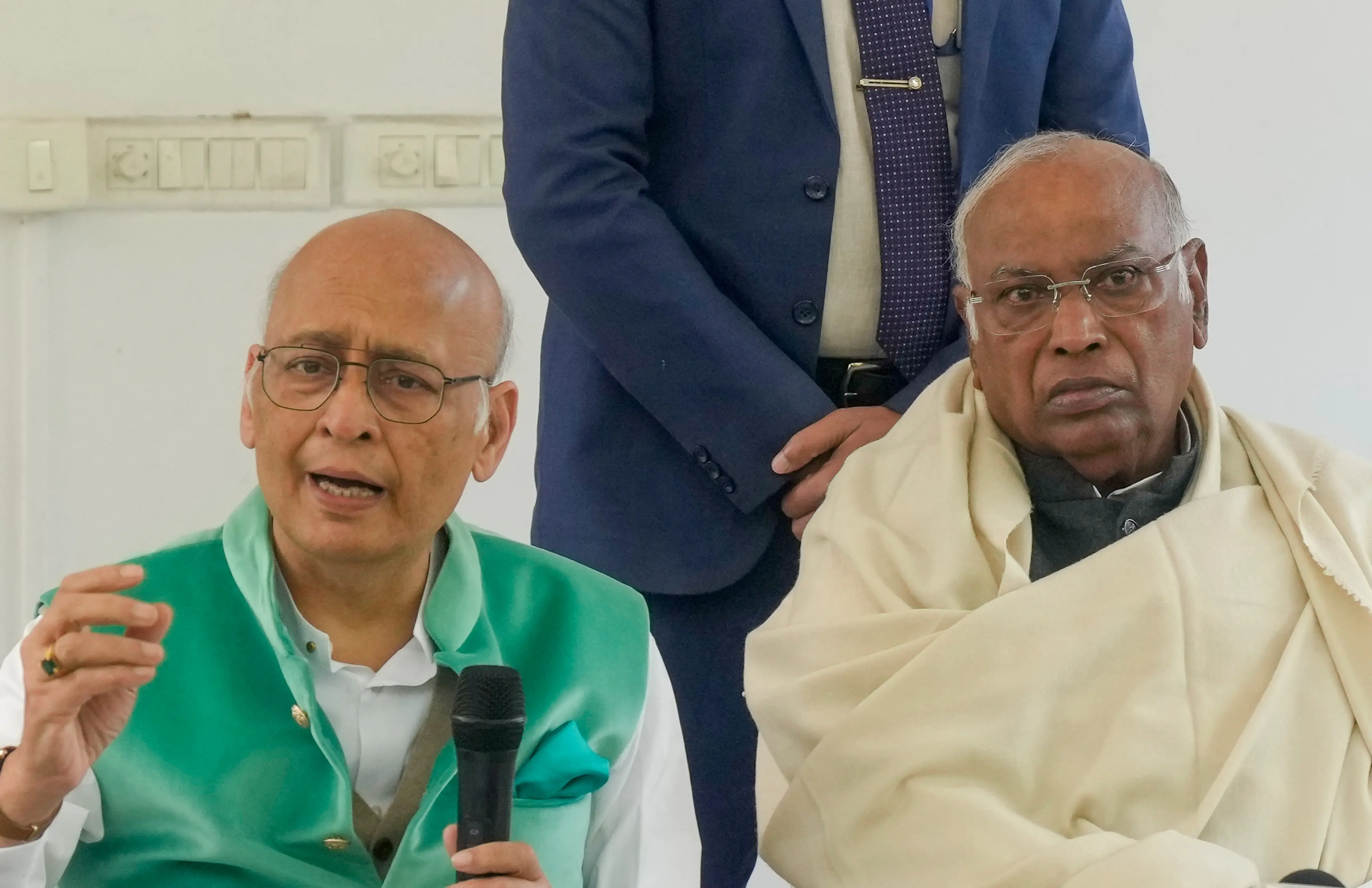 Congress President Mallikarjun Kharge, right, and party leader Abhishek Manu Singhvi address a press conference, in New Delhi, Wednesday, Dec. 17, 2025. | Photo: PTI