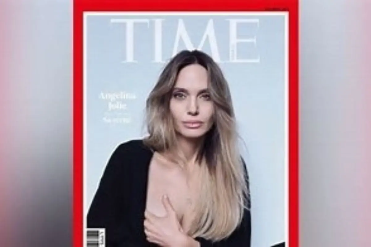 Angelina Jolie poses for the inaugural cover of Time Magazine France, where she openly reveals her mastectomy scars in a powerful statement on women's health, prevention, and informed choice. Photo: Time Magazine