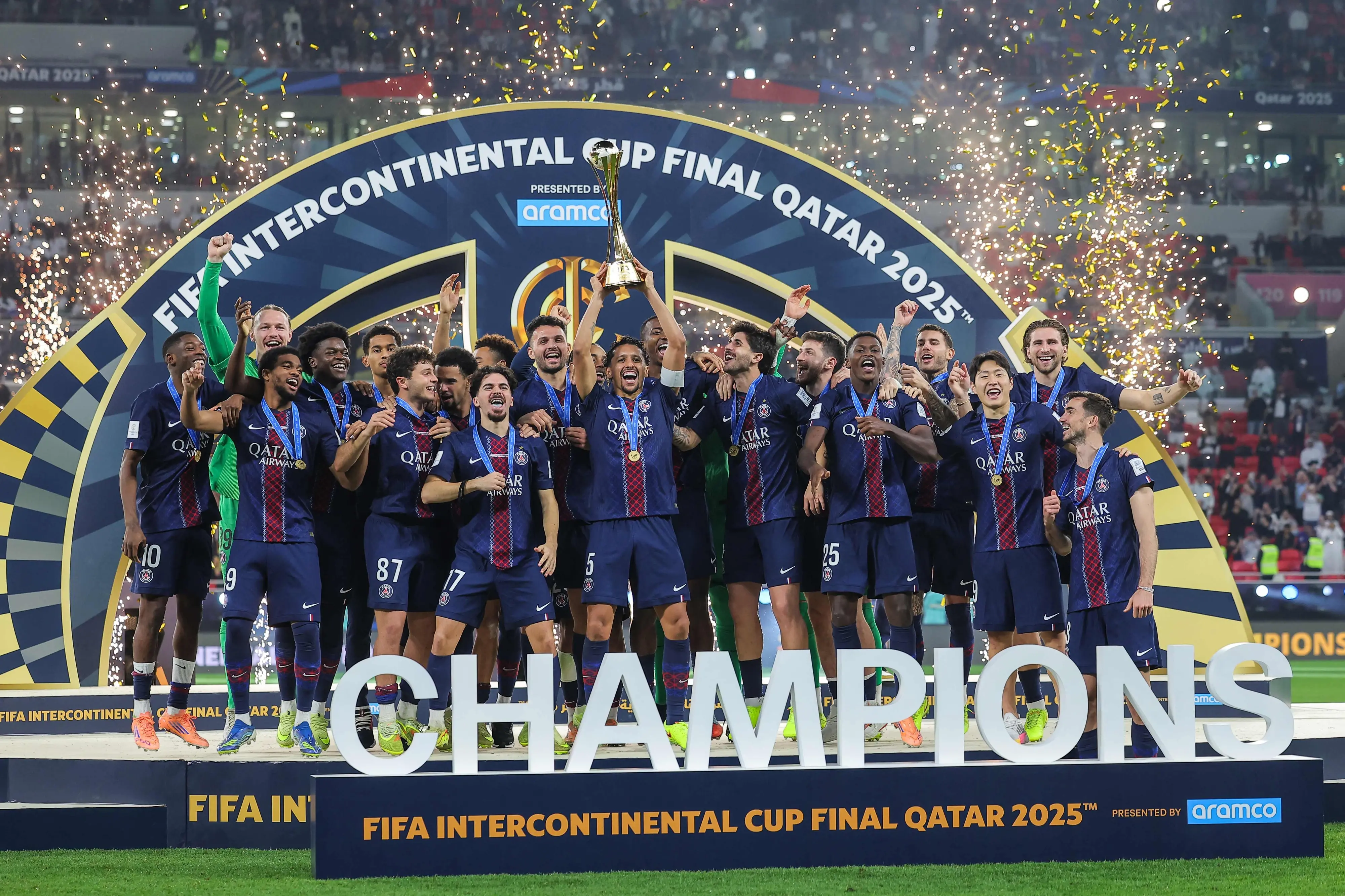 PSG players celebrate on the podium after winning the 2025 FIFA Intercontinental Cup  | AFP