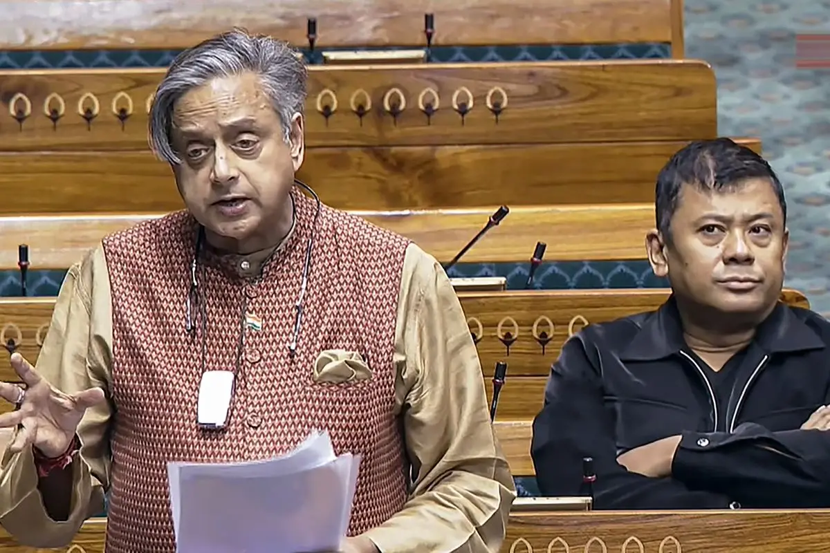Congress MP Shashi Tharoor speaks in the Lok Sabha during the Winter session of Parliament in New Delhi. |  (Sansad TV via PTI Photo)