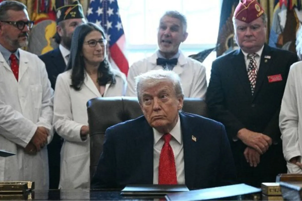 US President Donald Trump signs an executive order reclassifying medical marijuana to Schedule III at the White House on Thursday. Photo: AFP