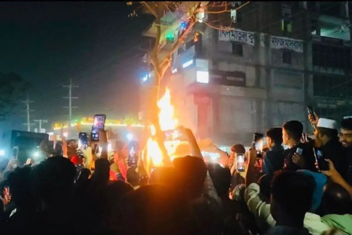 Bystanders record videos on their phones as a mob attacks a Hindu garment worker in Bangladesh's Mymensingh district over alleged blasphemy, in a chilling instance of mob violence unfolding in public view. Screengrab: X video
