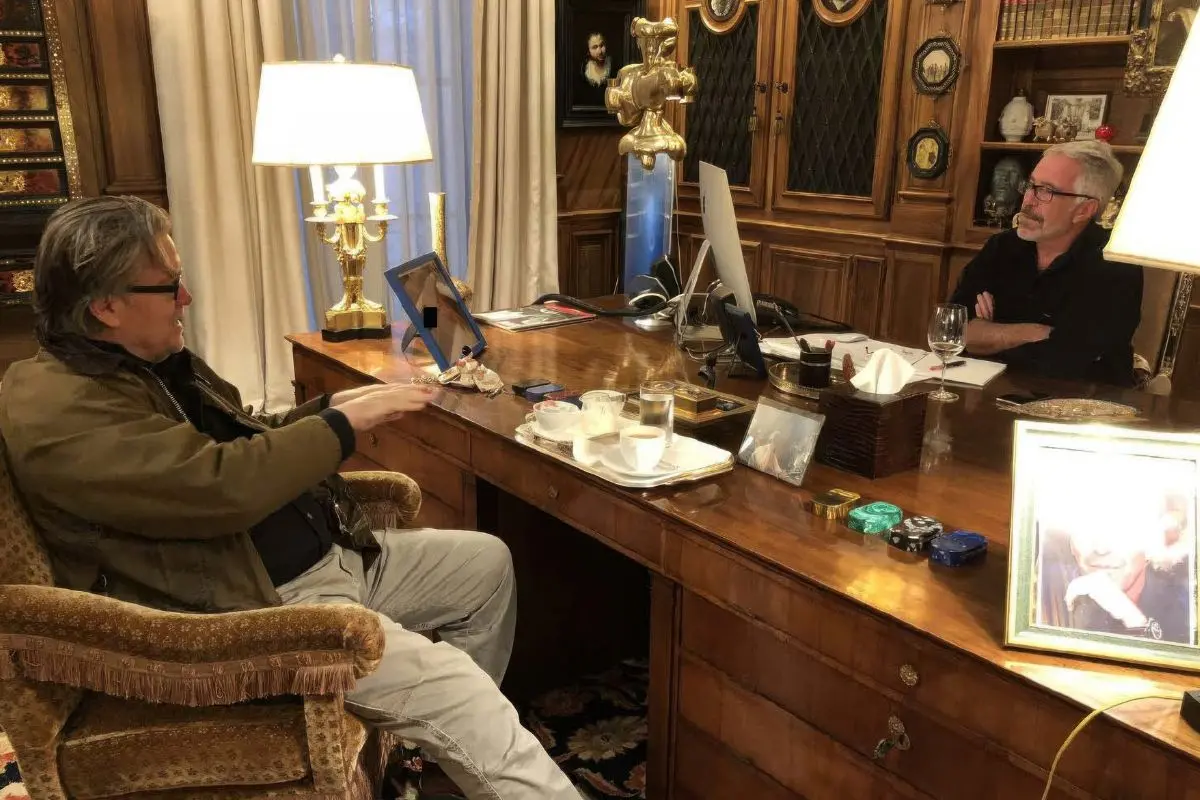 This undated photo released by Democrats on the House Oversight Committee Thursday, Dec. 18, 2025, shows Jeffrey Epstein talking with Steve Bannon. (House Oversight Committee via AP)