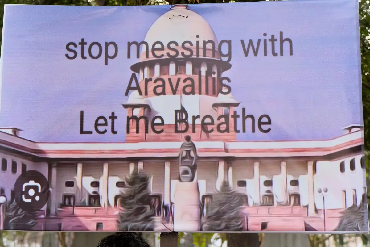 A member of 'Aravalli Bachao Sanstha' during a demonstration as part of the Save Aravalli movement, near the residence of Haryana minister Rao Narbir Singh, in Gurugram. | Photo: PTI