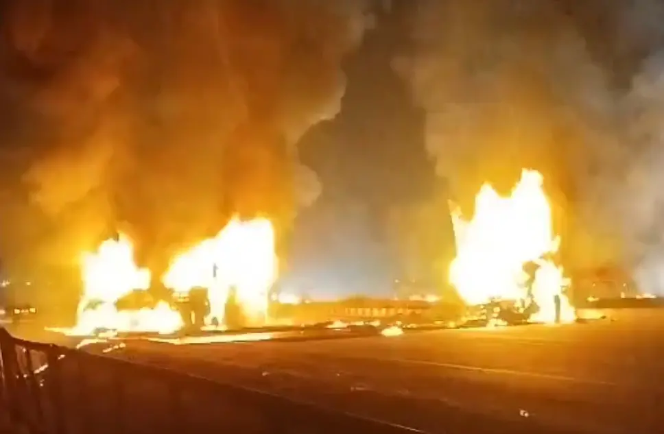 A private bus engulfed in flames after a collision with a container truck near Hiriyur in Karnataka's Chitradurga district