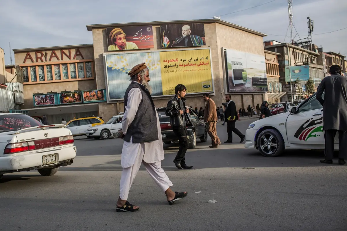 File Photo: Afghans make their way across a street in front of the Ariana cinema on November 6, 2012 in Kabul, Afghanistan. | Daniel Berehulak/Getty Images