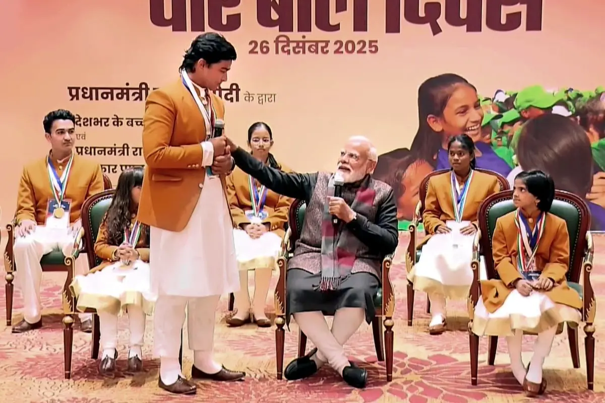 Prime Minister Narendra Modi interacts with cricketer Vaibhav Suryavanshi during a meeting with the recipients of 'Pradhan Mantri Rashtriya Bal Puraskar', at an event on 'Veer Baal Diwas', in New Delhi. (@NarendraModi/YT via PTI Photo)