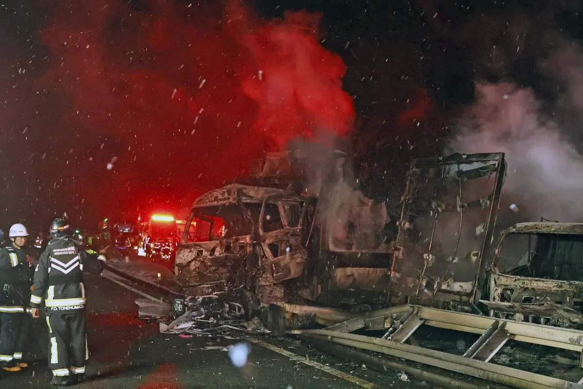 Burnt vehicles are seen after a massive crash in snowy weather on an expressway, in Minakami, northwest of Tokyo, early Saturday | Phioto: AP