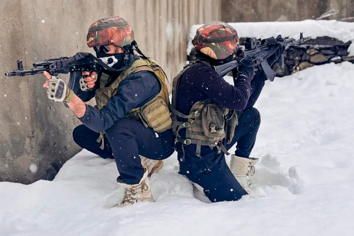 In this image received on Dec. 27, 2025, army and security personnel keep a vigil as part of counter-terrorism operations at a snow-capped mountain range, in Jammu and Kashmir. | Photo: PTI