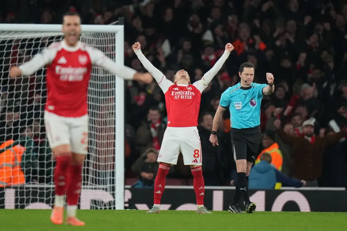 Arsenal's Martin Odegaard celebrates after his teammate Arsenal's Leandro Trossard scored his side's third goal | Photo: AP