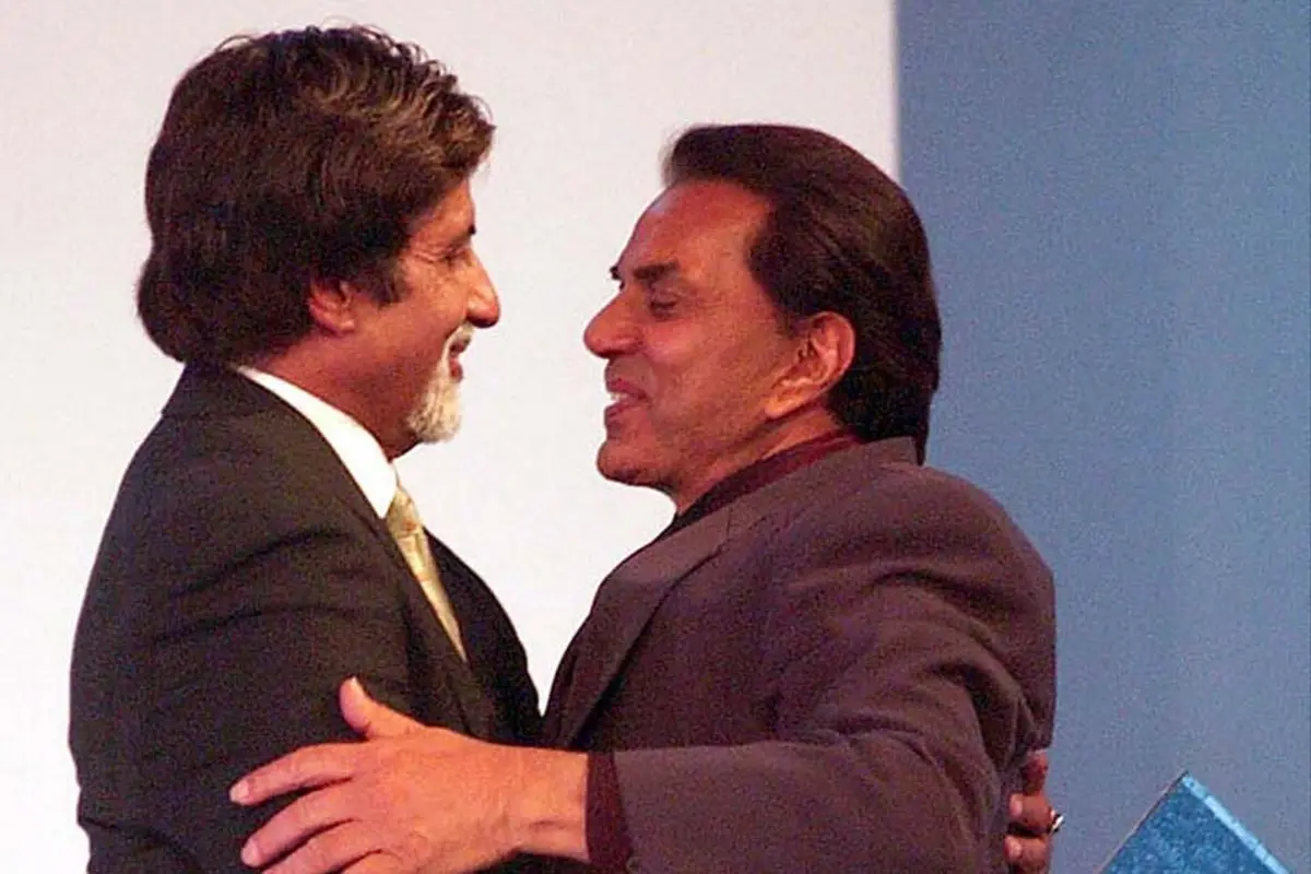 Actor Dharmendra hugs Amitabh Bachchan