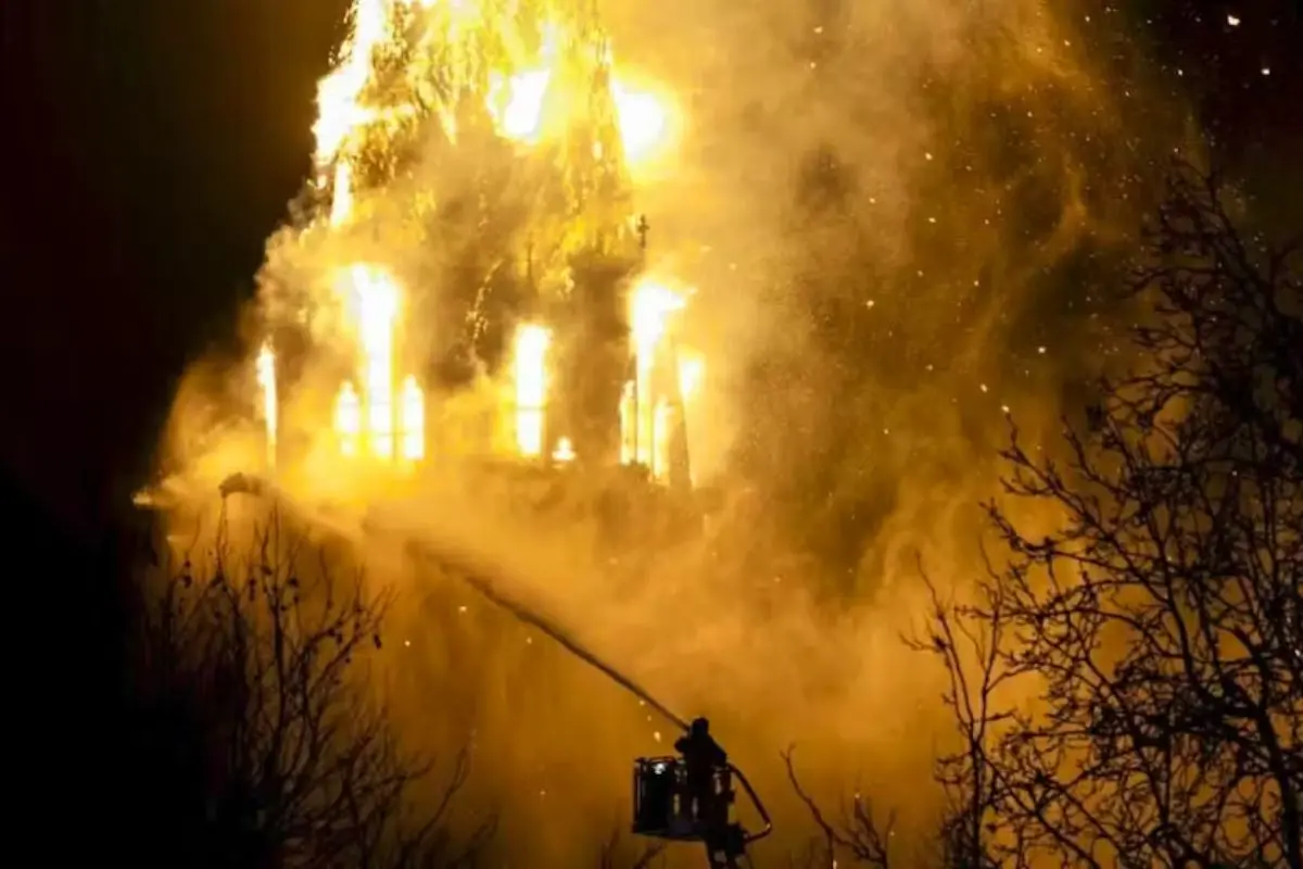Flames engulf the historic Vondelkerk in Amsterdam as the church tower collapses following a massive fire after New Year celebrations.