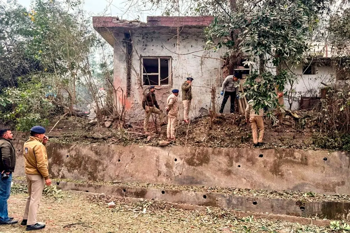 Security personnel investigate the site after a reported explosion near a police station in Himachal Pradesh's Solan district, Thursday, Jan. 1, 2026. (PTI Photo)