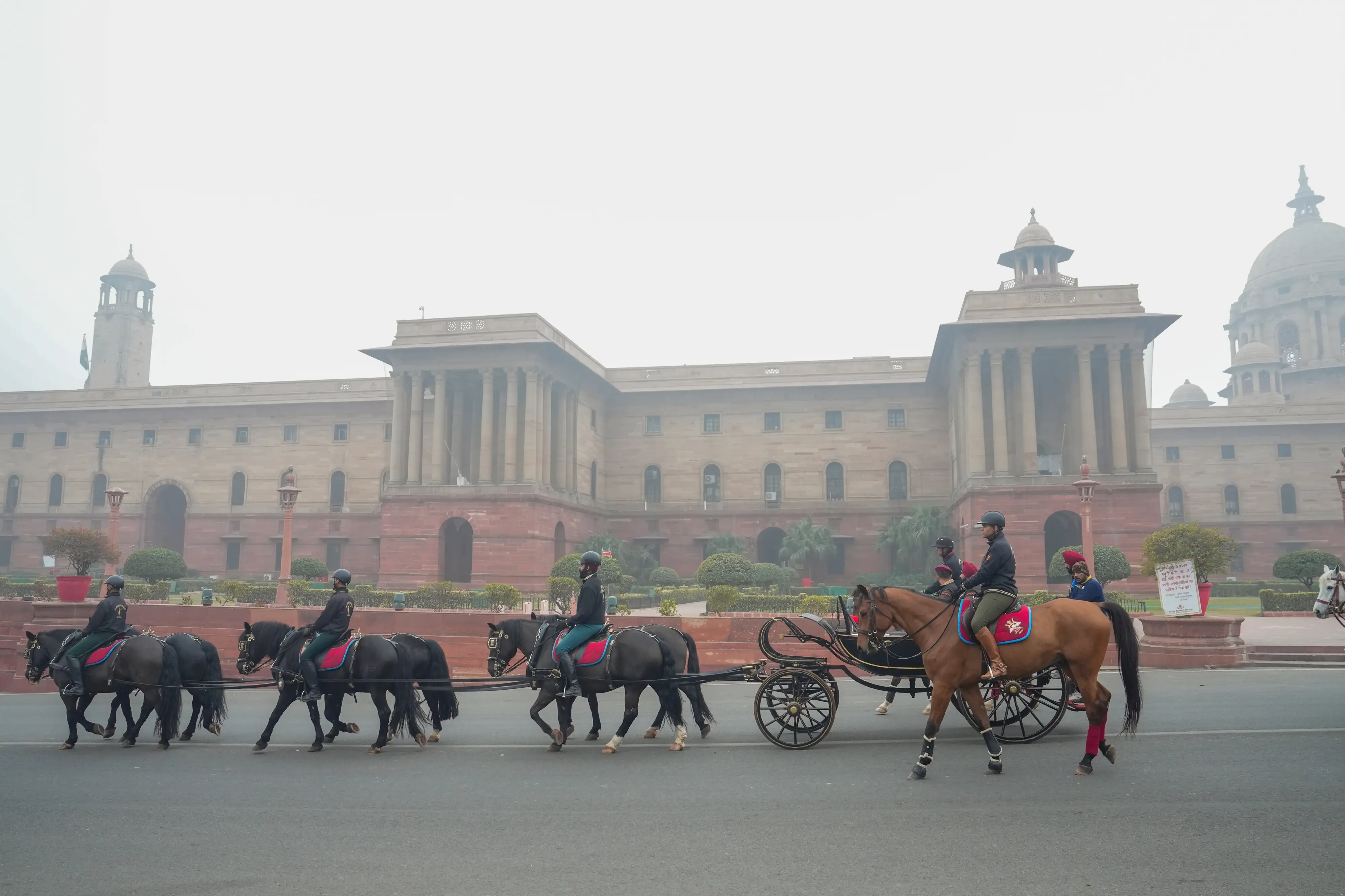 The President's Bodyguards march past during rehearsals ahead of the 'Republic Day Parade' on a foggy winter morning, near the Vijay Chowk in New Delhi | Photo: PTI