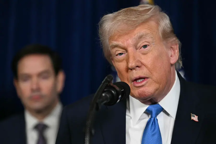 US Secretary of State Marco Rubio looks on as US President Donald Trump speaks to the press following US military actions in Venezuela