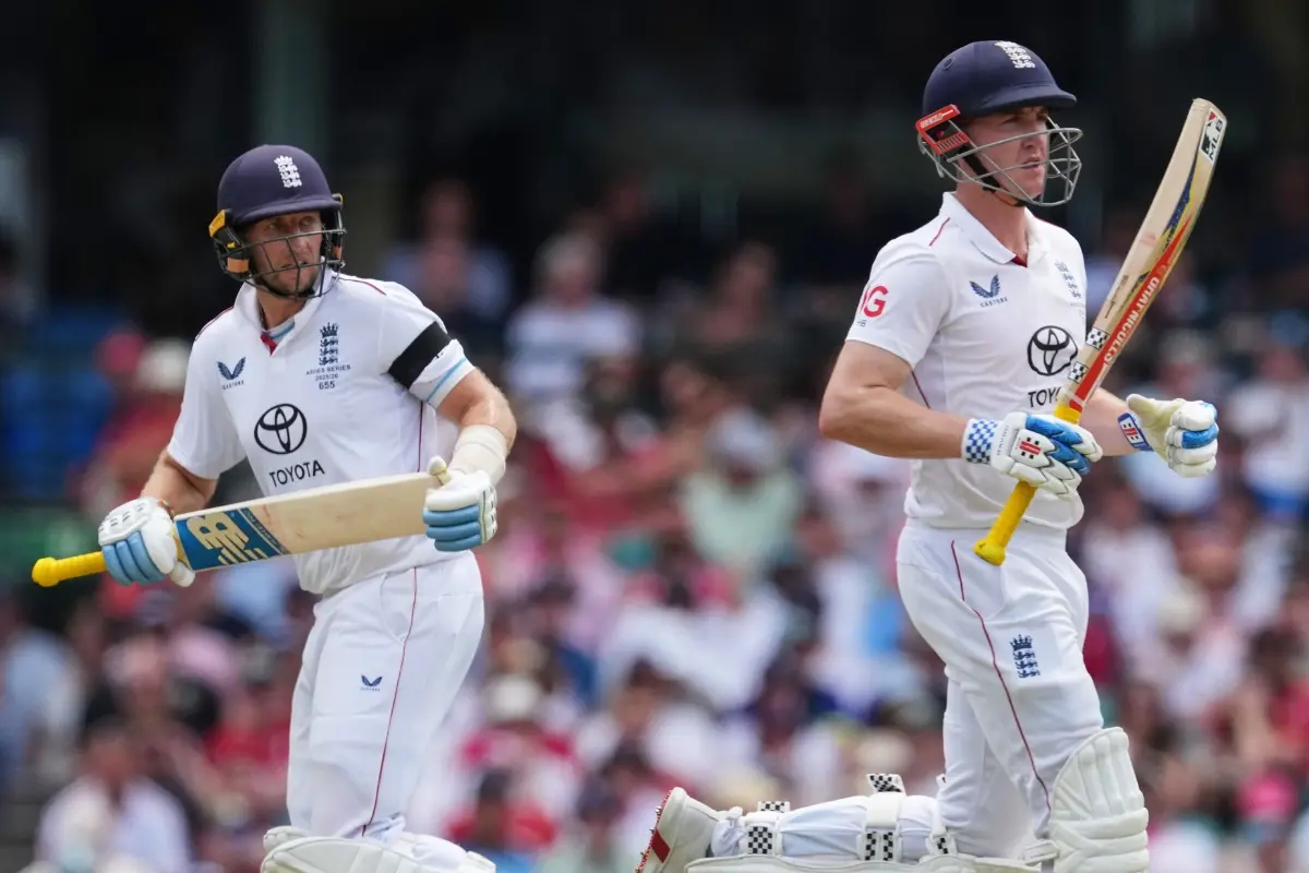 England's Joe Root runs between the wickets with teammate Harry Brook, right, during play on day one of the fifth and final Ashes | Photo: AP