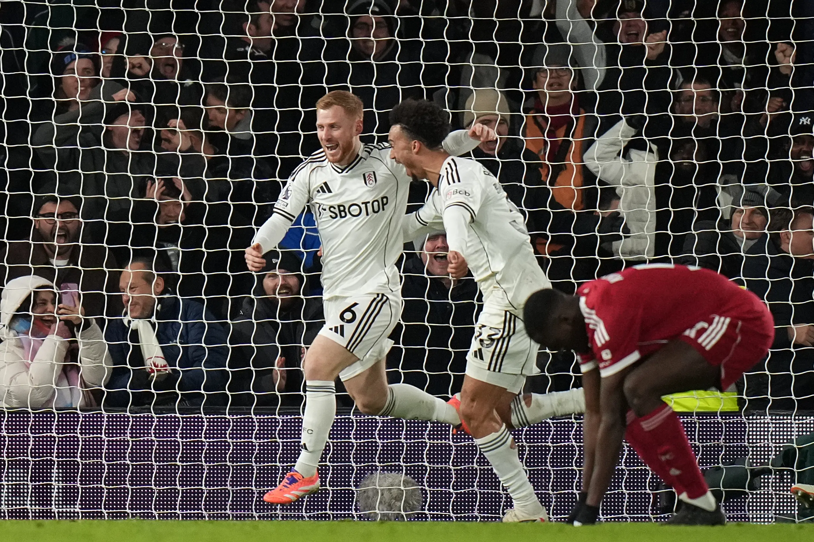 Fulham's Harrison Reed, left, celebrates after scoring his side's second goal | AP
