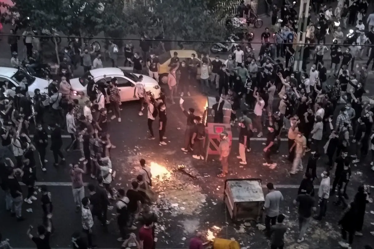 FILE - Iranians protest a 22-year-old woman Mahsa Amini's death after she was detained by the morality police