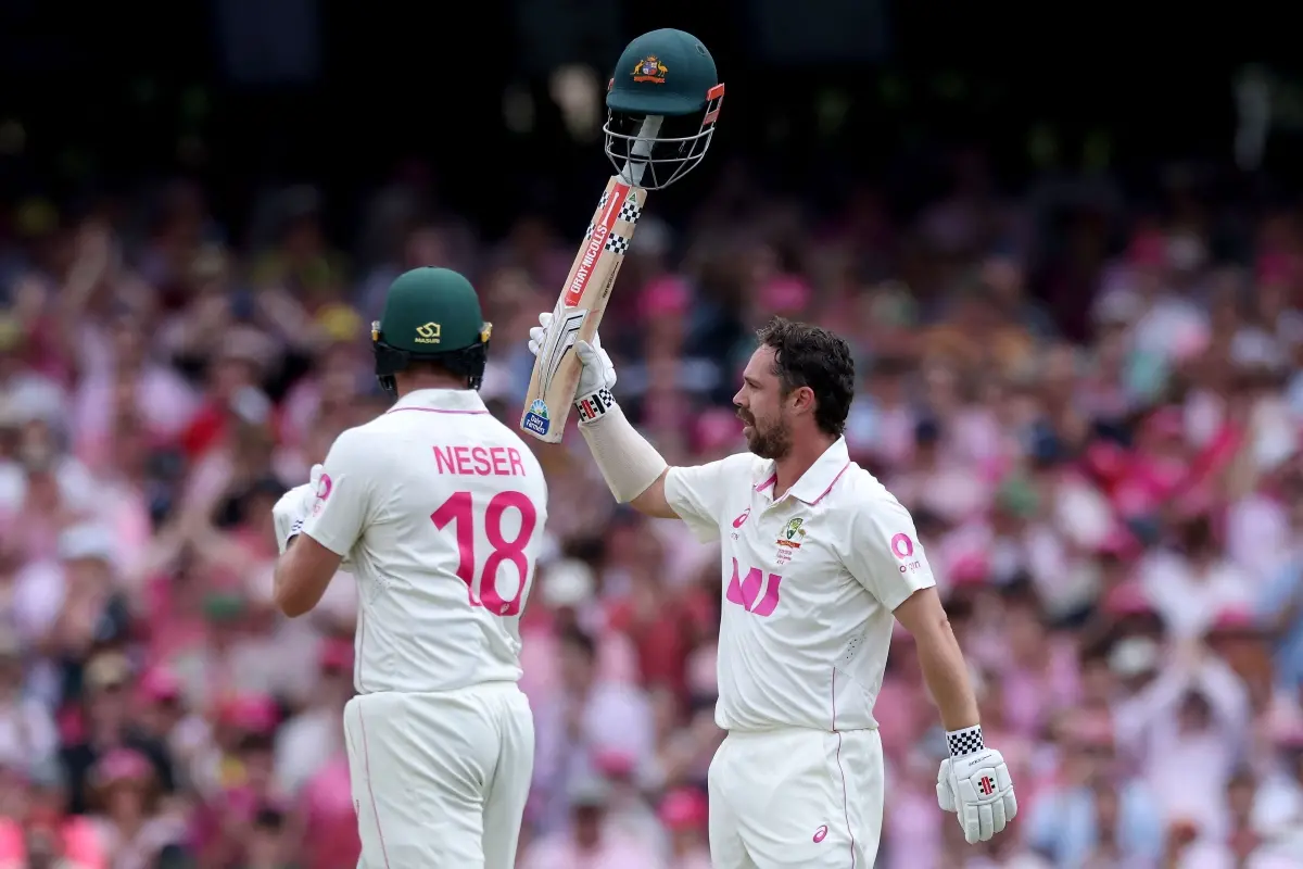 Australia's Travis Head (R) celebrates reaching his century (100-runs) on day three of the fifth Ashes cricket Test between Australia and England at the Sydney Cricket Ground. | Photo: AFP