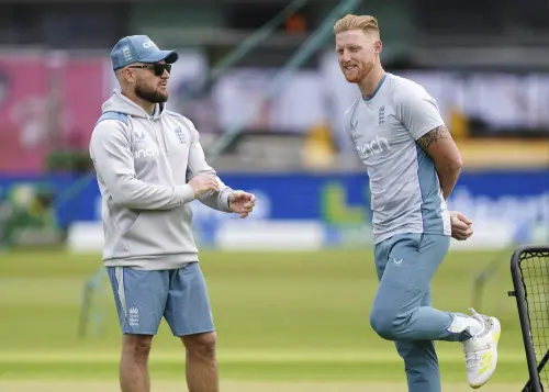 England head coach Brendon McCullum, left, and Ben Stokes stretches during a nets session at Trent Bridge Cricket Ground, Nottingham, England. (File Photo: AP)