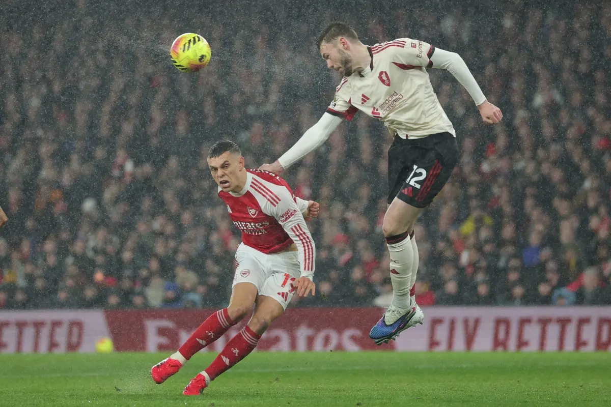 Liverpool's Conor Bradley heads the ball over Arsenal's Leandro Trossard during the English Premier League | Photo: AP