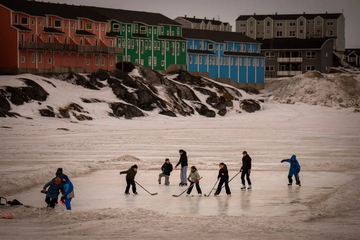 Children play on an icy surface in Nuuk, Greenland, Feb. 16, 2025 (Photo: AP)