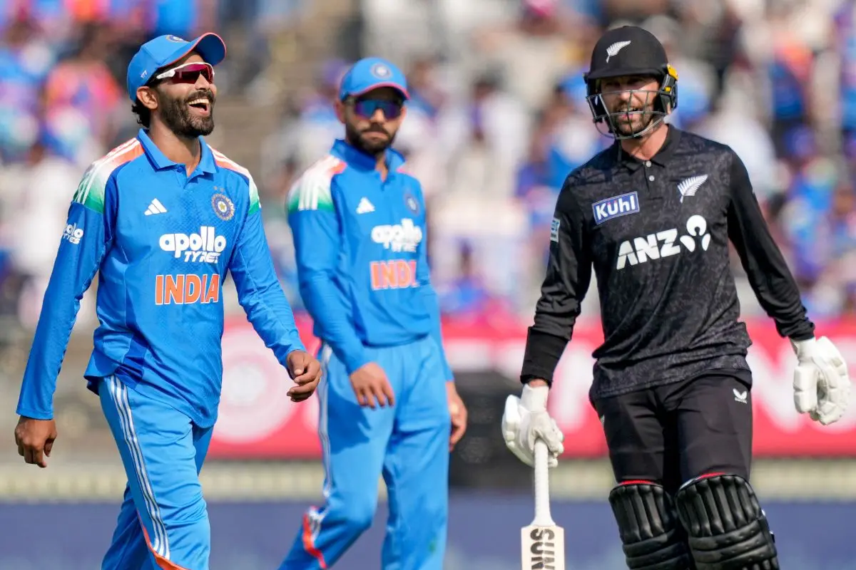 Ravindra Jadeja, left, and New Zealand's Devon Conway, right, during the first ODI cricket match of a series between India and New Zealand. (PTI Photo/Ravi Choudhary)