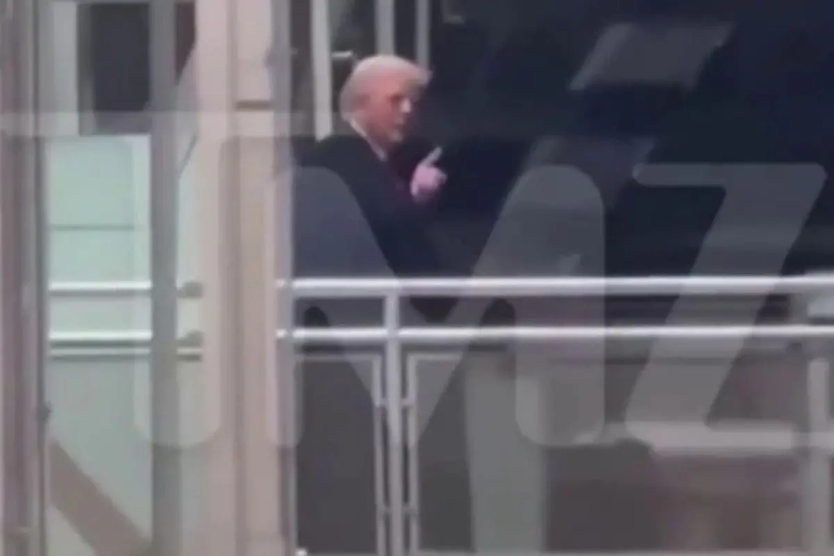 US President Donald Trump gestures toward a heckler during a visit to a Ford Motor Company manufacturing plant in Michigan, in a moment that went viral on social media.