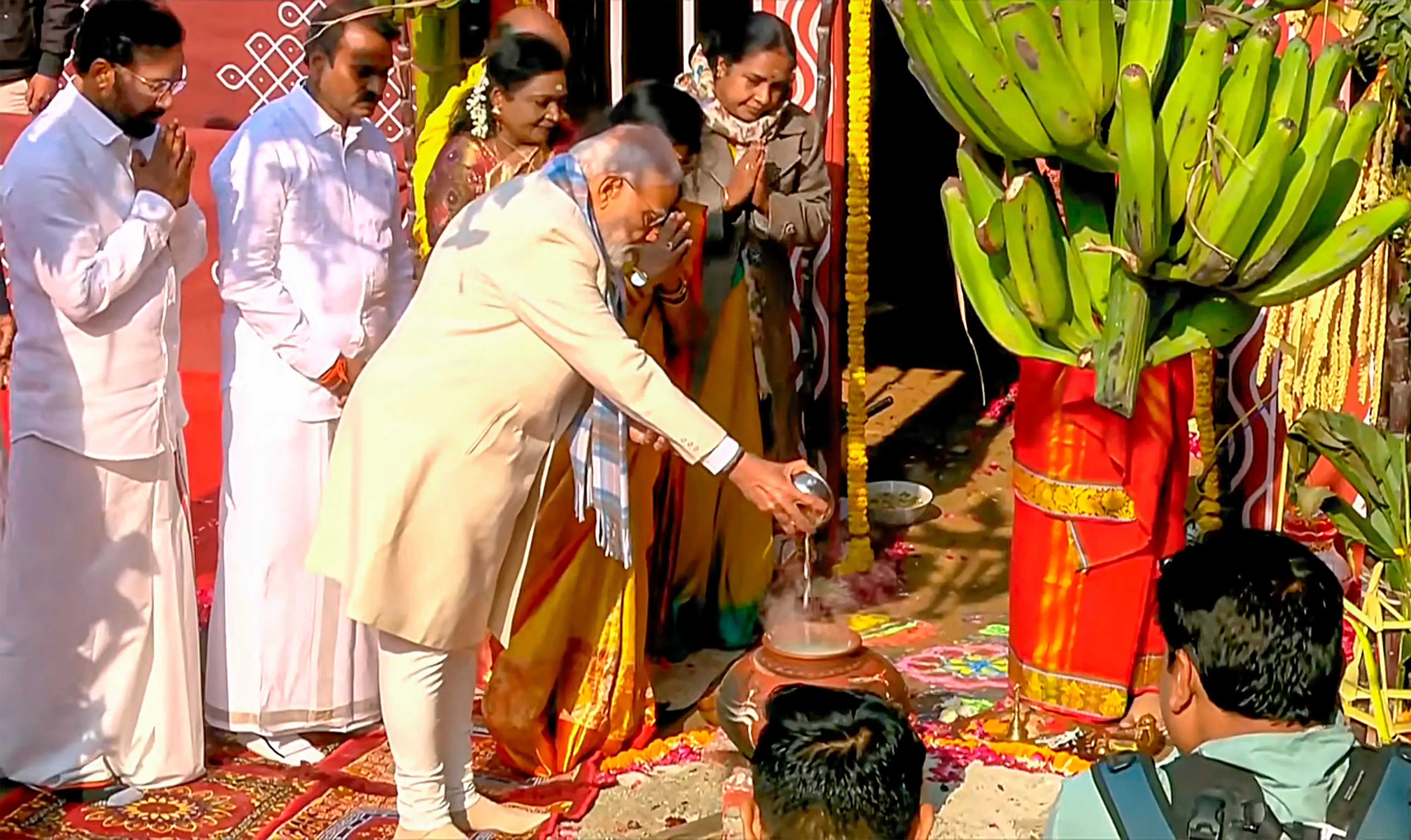 Prime Minister Narendra Modi offers prayers during the 'Pongal' festival celebration at Union Minister of State for Parliamentary Affairs L Murugan's residence in New Delhi | Photo: PTI