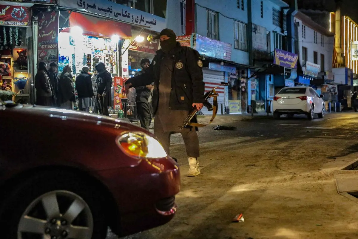 Taliban security personnel stand guard at a blast site following an explosion in the Shahr-e Naw area of Kabul on January 19, 2026. A blast at a Chinese restaurant in central Kabul on January 19 killed a Chinese man and six Afghans, the police force in the Afghan capital said. (Photo by AFP)