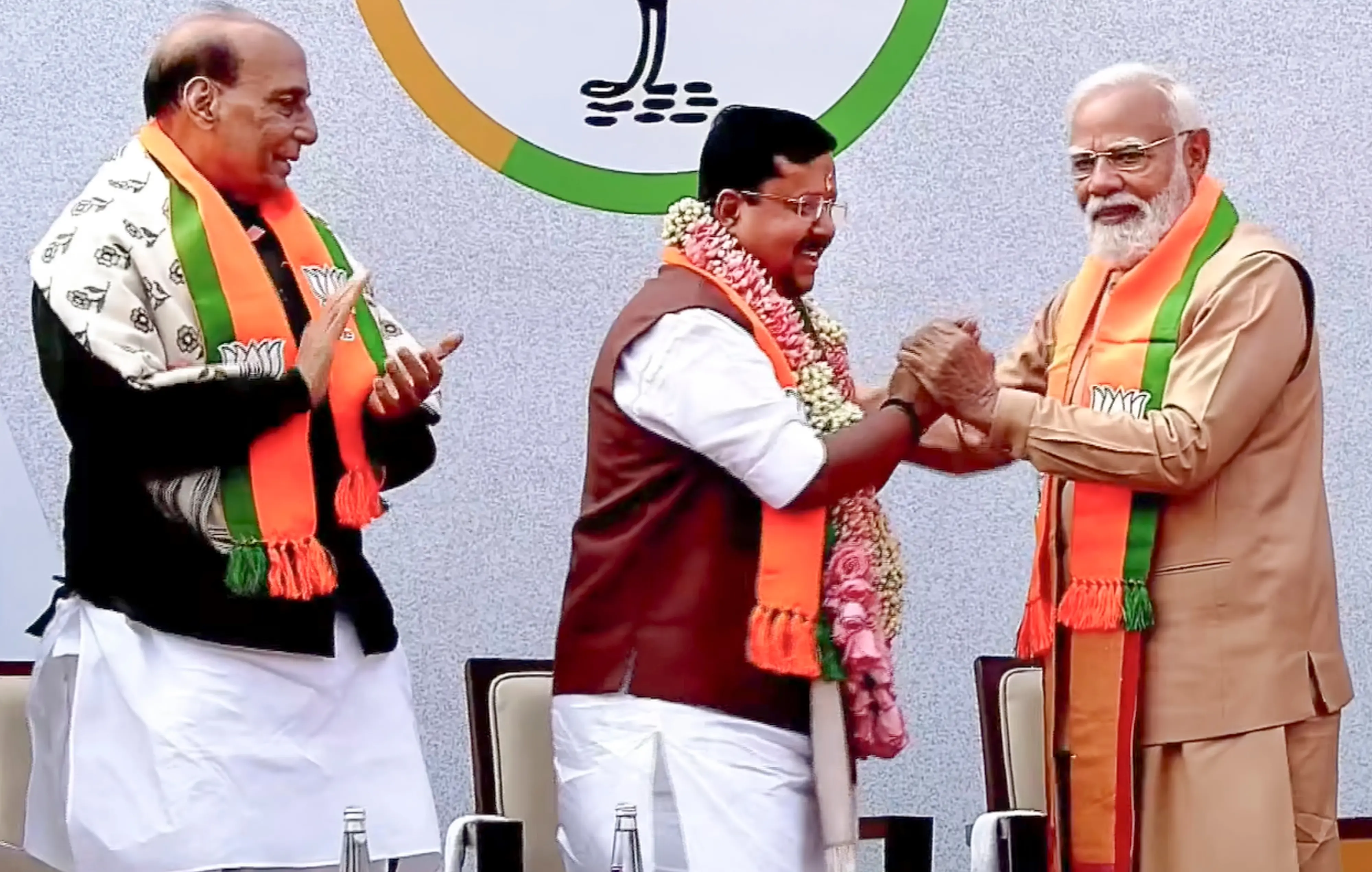 Prime Minister Narendra Modi felicitates newly elected BJP National President Nitin Nabin as the latter takes charge at party headquarters in New Delhi. Defence Minister Rajnath Singh is also seen | Photo: PTI