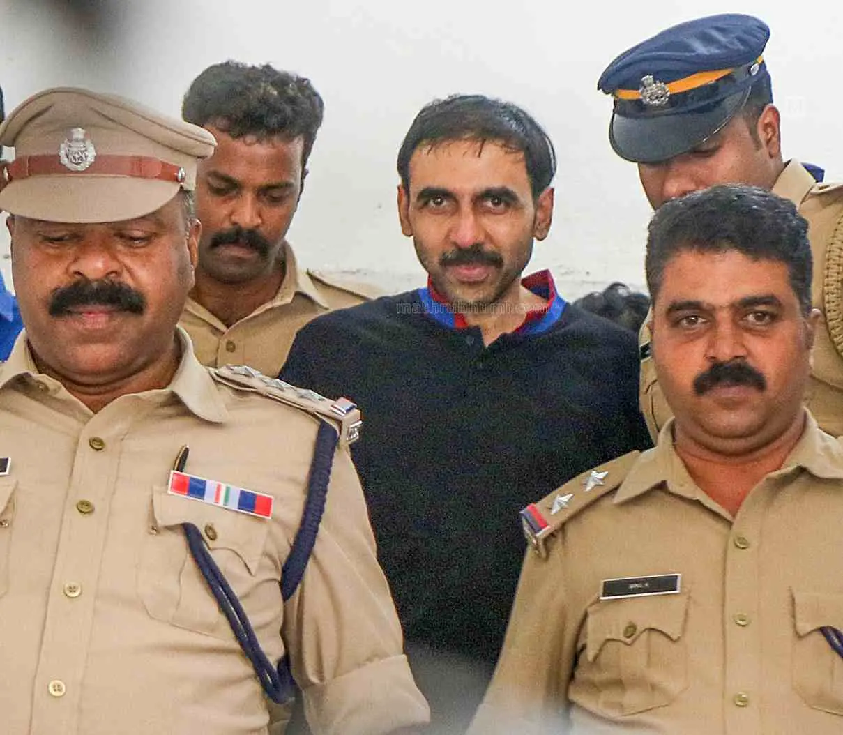 Unnikrishnan Potti under police escort | Photo: Mathrubhumi