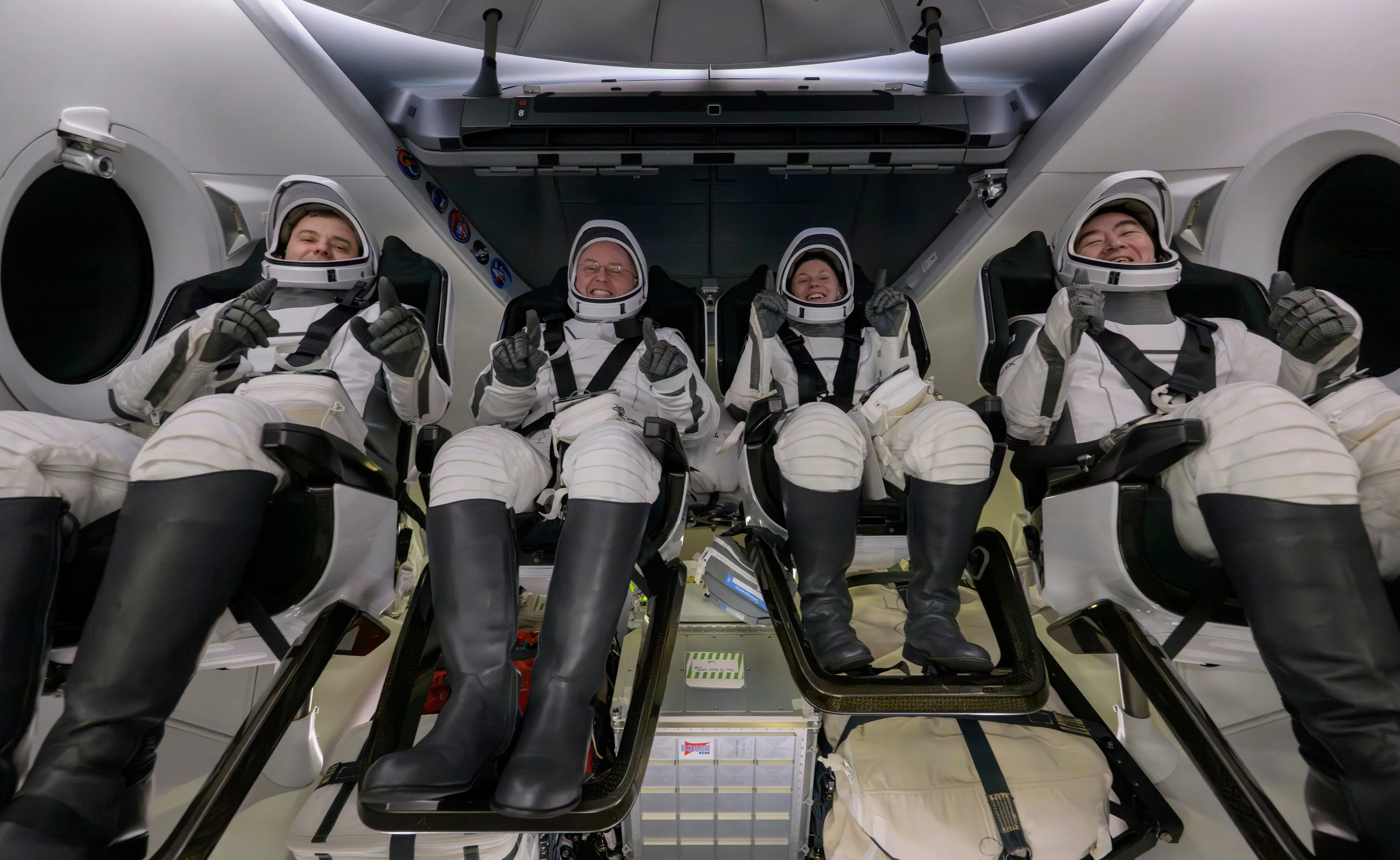 Roscosmos cosmonaut Oleg Platonov, left, NASA astronauts Mike Fincke, Zena Cardman, and JAXA (Japan Aerospace Exploration Agency) astronaut Kimiya Yui are seen inside the SpaceX Dragon Endeavour spacecraft onboard the SpaceX recovery ship SHANNON shortly after having landed in the Pacific Ocean off the coast of Long Beach | Photo: AP