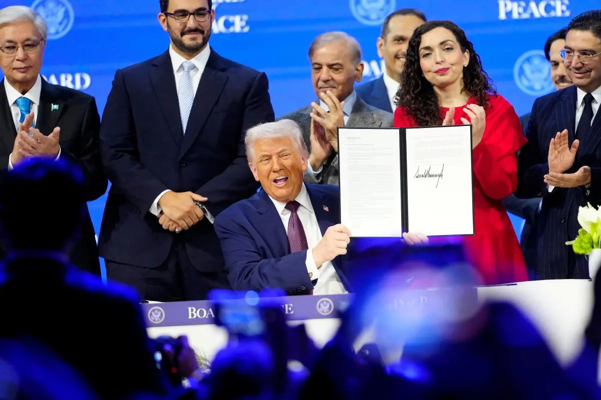 President Donald Trump holds the charter during a signing ceremony on his Board of Peace initiative at the Annual Meeting of the World Economic Forum in Davos, Switzerland. | Photo: AP