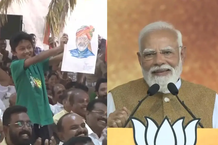 PM Modi paused his address to acknowledge a young boy holding his photo