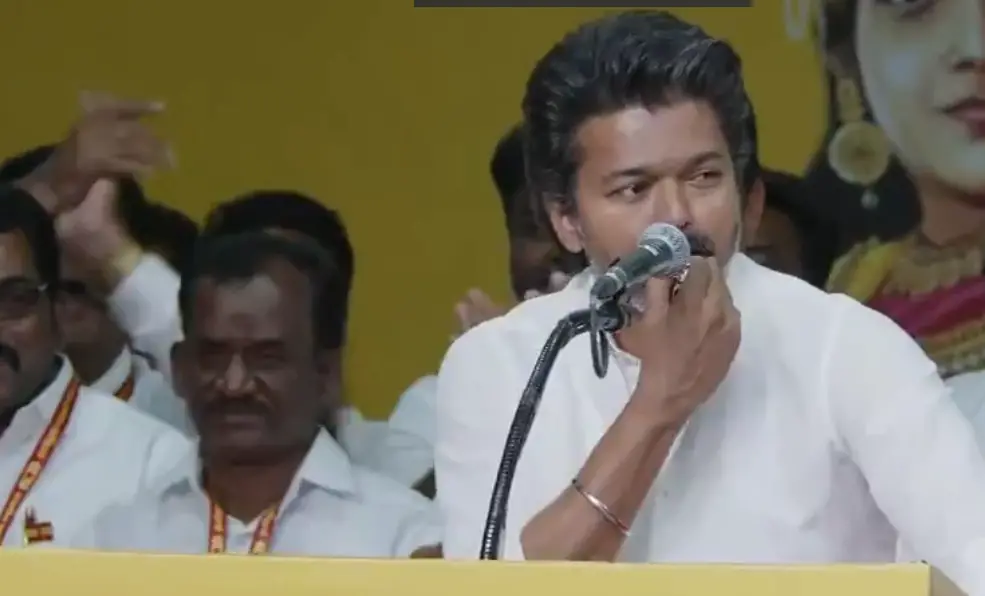 Vijay blows a whistle at the event